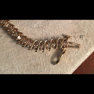 10 caret solid gold diamond bracelet.